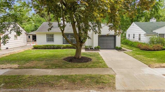 15589 Kirkshire Ave, Beverly Hills, MI 48025 - view of front of property with a front lawn, concrete driveway, an attached garage, and brick siding