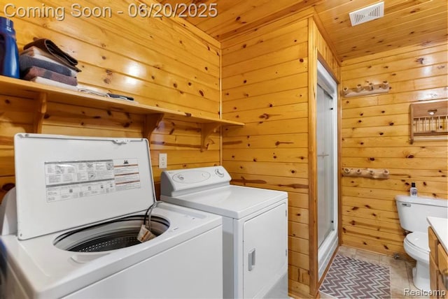 18031 State Highway M28, Newberry, MI 49868 - washroom with wooden walls, separate washer and dryer, wood ceiling, and light tile patterned flooring