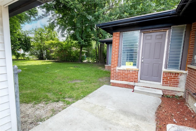 16788 Lincoln Ave, Eastpointe, MI 48021 - property entrance with a lawn and brick siding