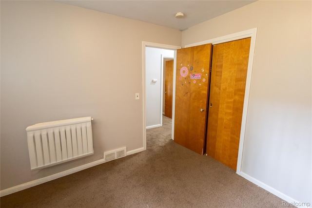 16788 Lincoln Ave, Eastpointe, MI 48021 - carpeted empty room featuring radiator heating unit and a smoke detector