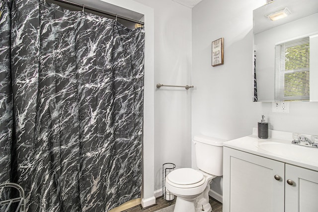 6236 Arbutus, Idlewild, MI 49642 - full bath featuring vanity, wood finished floors, and a shower with shower curtain