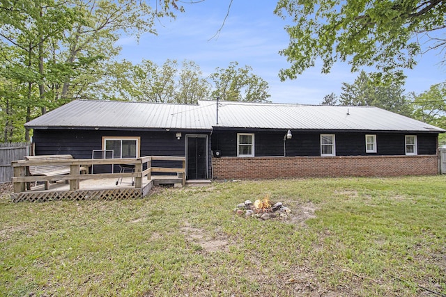 6236 Arbutus, Idlewild, MI 49642 - view of front facade with a deck