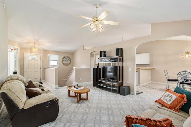 13380 Park Blvd W, Vicksburg, MI 49097 - living area featuring arched walkways, light carpet, vaulted ceiling, and a ceiling fan