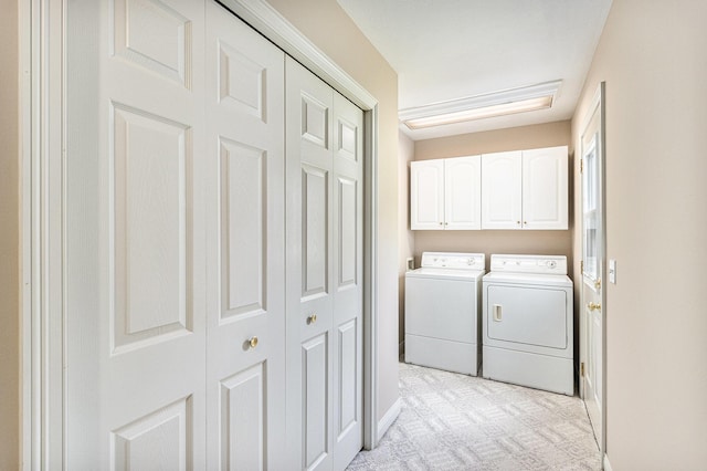 13380 Park Blvd W, Vicksburg, MI 49097 - laundry area featuring separate washer and dryer, cabinet space, and light colored carpet