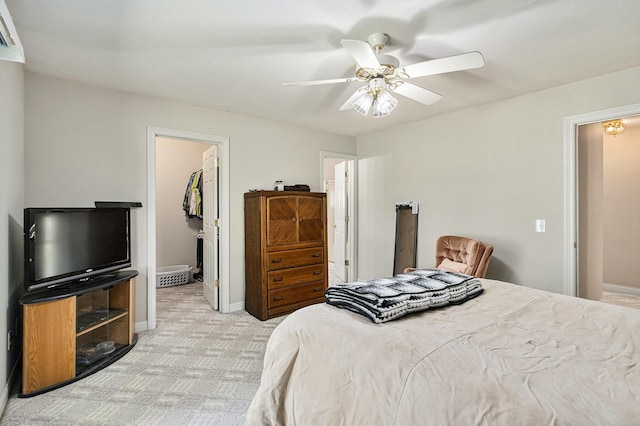 13380 Park Blvd W, Vicksburg, MI 49097 - bedroom featuring a walk in closet, light carpet, a closet, and a ceiling fan