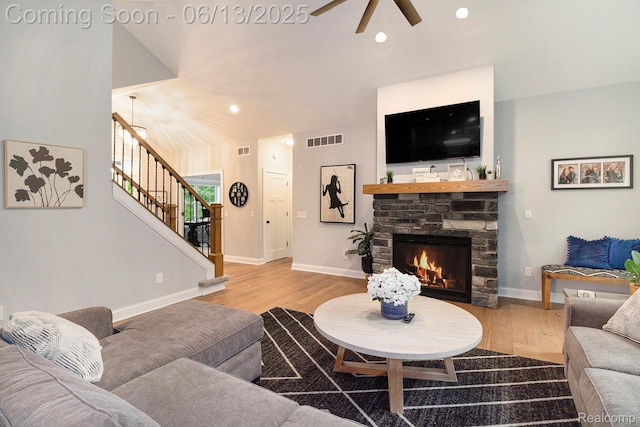 5950 Mountain Top Dr, Brighton, MI 48116 - living room with a ceiling fan, wood finished floors, stairway, a stone fireplace, and recessed lighting