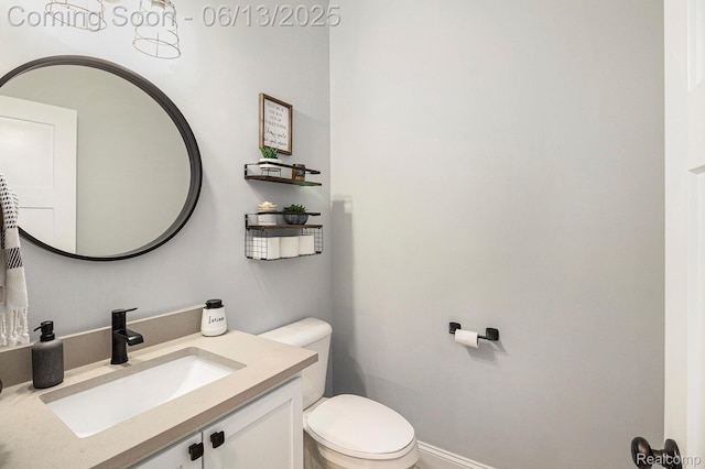 5950 Mountain Top Dr, Brighton, MI 48116 - bathroom featuring toilet and vanity