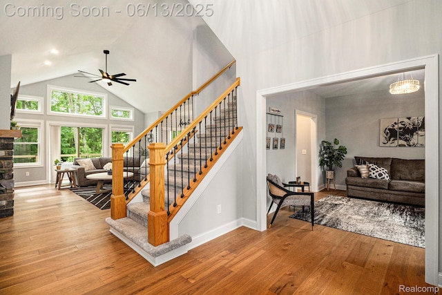 5950 Mountain Top Dr, Brighton, MI 48116 - stairway featuring ceiling fan, high vaulted ceiling, and hardwood / wood-style flooring