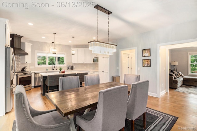 5950 Mountain Top Dr, Brighton, MI 48116 - dining space featuring light wood-style flooring and recessed lighting