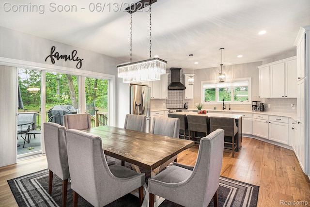 5950 Mountain Top Dr, Brighton, MI 48116 - dining room with light wood finished floors and recessed lighting