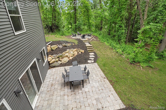 5950 Mountain Top Dr, Brighton, MI 48116 - view of patio with an outdoor fire pit and outdoor dining space