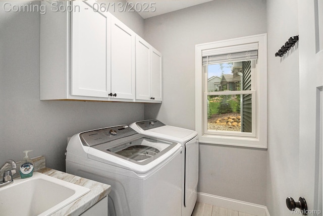 5950 Mountain Top Dr, Brighton, MI 48116 - washroom featuring cabinet space and washer and dryer