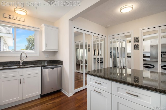 11124 Colony Rd, Pinckney, MI 48169 - kitchen with dishwasher, dark wood-style floors, white cabinetry, and dark stone countertops
