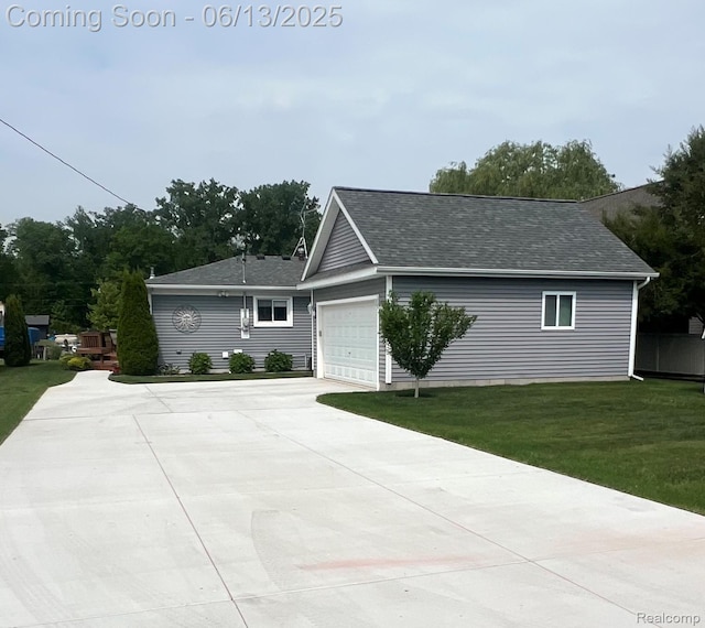 11124 Colony Rd, Pinckney, MI 48169 - single story home with a front yard, concrete driveway, a garage, and roof with shingles