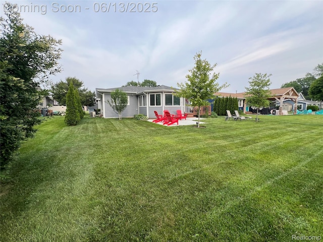 11124 Colony Rd, Pinckney, MI 48169 - view of grassy yard with a patio