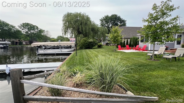 11124 Colony Rd, Pinckney, MI 48169 - dock area featuring a lawn, a patio, and a water view