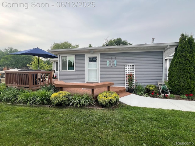 11124 Colony Rd, Pinckney, MI 48169 - view of front facade with a wooden deck and a front lawn