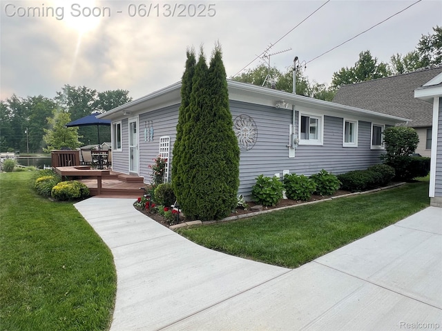 11124 Colony Rd, Pinckney, MI 48169 - view of home's exterior with a deck and a lawn