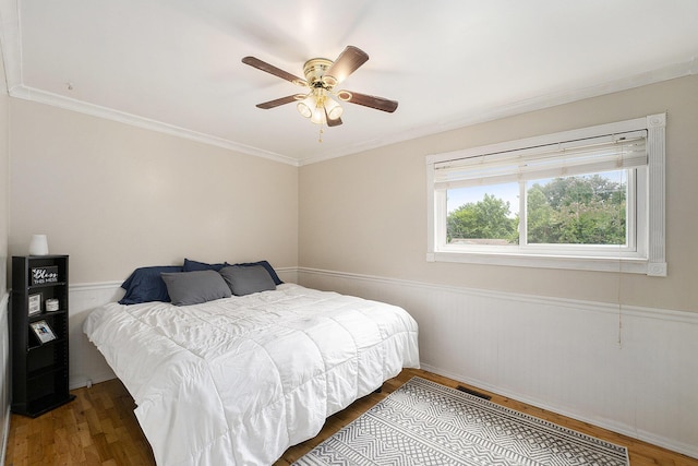 1143 S John Hix St, Westland, MI 48186 - bedroom featuring wood finished floors, crown molding, ceiling fan, and wainscoting