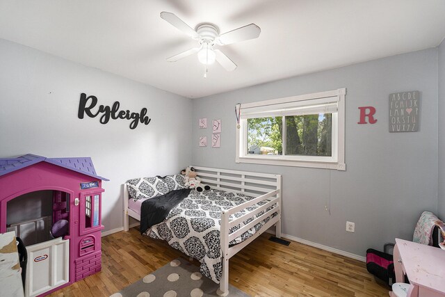 1143 S John Hix St, Westland, MI 48186 - bedroom with wood finished floors and a ceiling fan