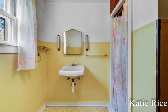 8974 Park St, Montague, MI 49437 - bathroom featuring curtained shower and a sink