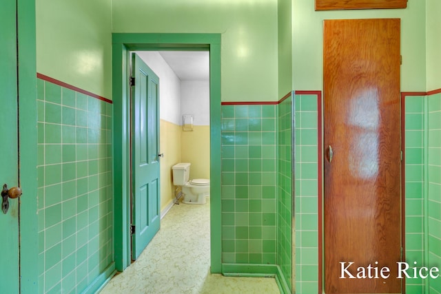8974 Park St, Montague, MI 49437 - bathroom with tile walls and a wainscoted wall