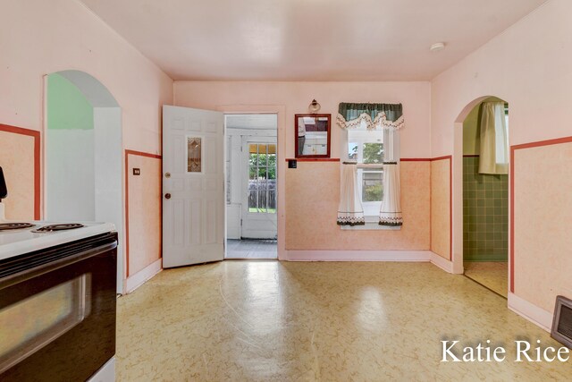 8974 Park St, Montague, MI 49437 - foyer with arched walkways and a wainscoted wall