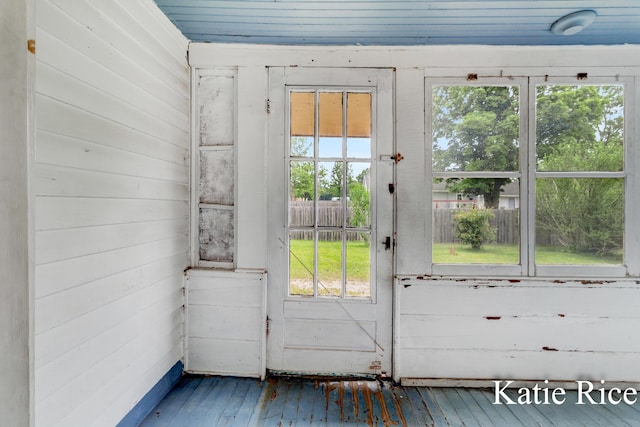 8974 Park St, Montague, MI 49437 - entryway with healthy amount of natural light, wood-type flooring, and wood walls