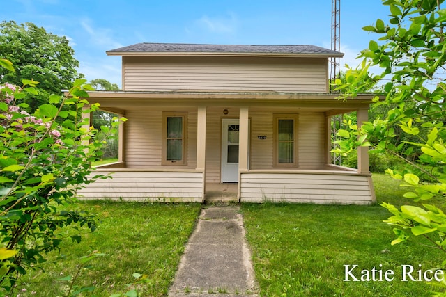 8974 Park St, Montague, MI 49437 - bungalow-style house with a porch and a front yard