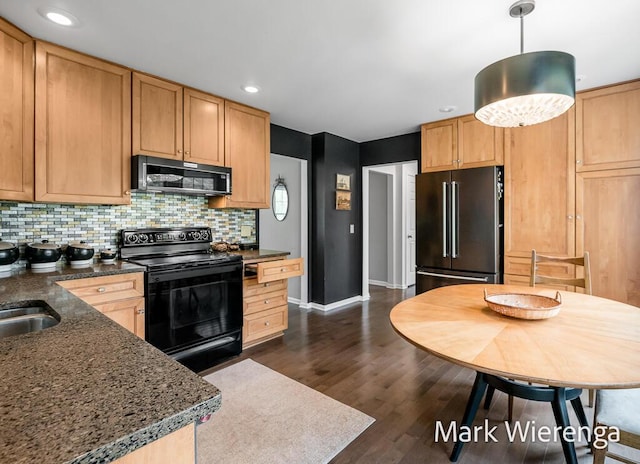 334 Terrill Ave, Grand Haven, MI 49417 - kitchen featuring black appliances, backsplash, dark wood finished floors, recessed lighting, and hanging light fixtures