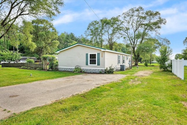 6626 Dennison Rd, Plainwell, MI 49080 - view of side of home featuring a central AC unit