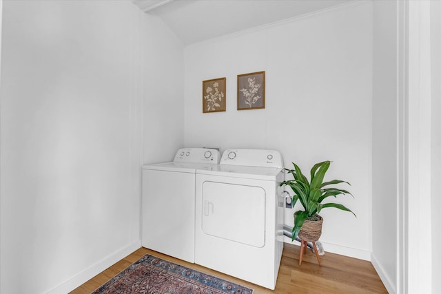 6626 Dennison Rd, Plainwell, MI 49080 - laundry room with washer and dryer and light wood-style flooring