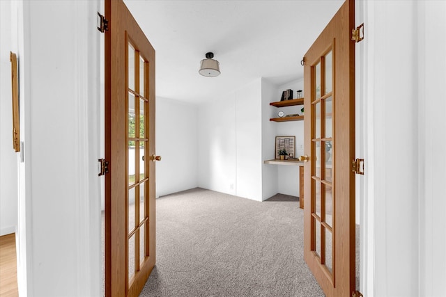 6626 Dennison Rd, Plainwell, MI 49080 - hallway featuring french doors and light colored carpet