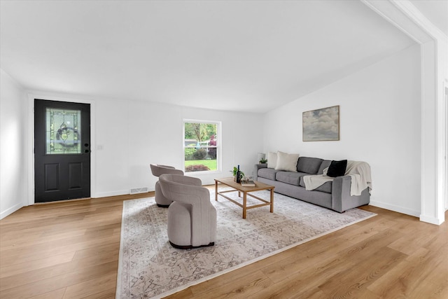 6626 Dennison Rd, Plainwell, MI 49080 - living area with light wood-style flooring and lofted ceiling