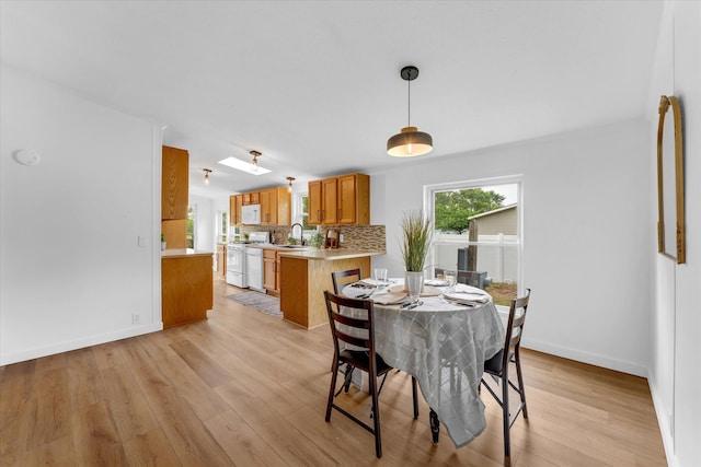 6626 Dennison Rd, Plainwell, MI 49080 - dining area with light wood-style floors and baseboards