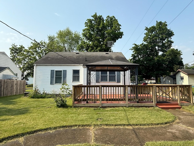 216 Bradley St, Dowagiac, MI 49047 - rear view of property with a gazebo, a deck, and roof with shingles
