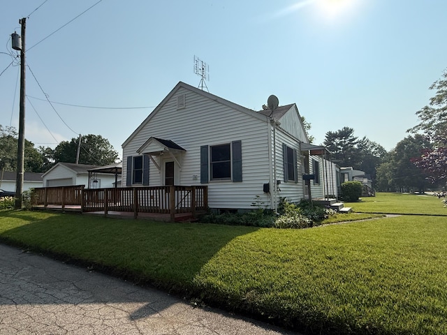 216 Bradley St, Dowagiac, MI 49047 - view of front of property featuring a front lawn and a wooden deck
