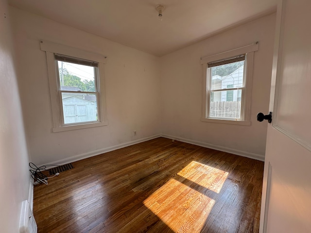 216 Bradley St, Dowagiac, MI 49047 - empty room with hardwood / wood-style floors