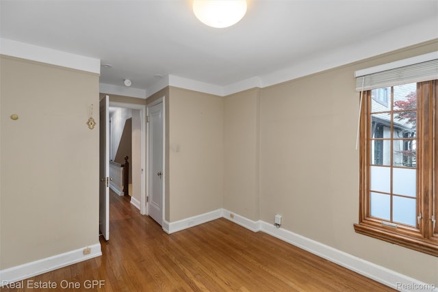 542 Cadieux Rd, Grosse Pointe, MI 48230 - spare room featuring baseboards and light wood-type flooring