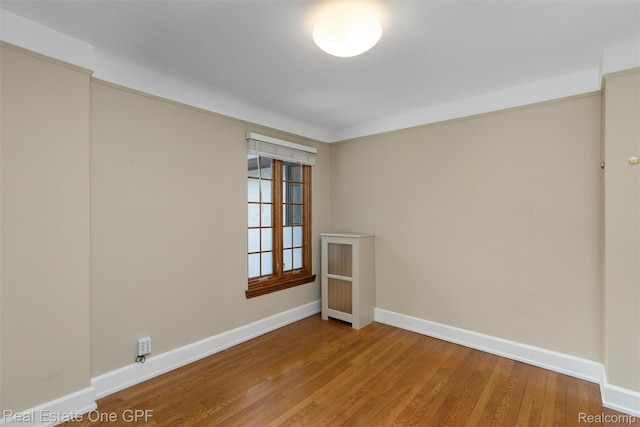 542 Cadieux Rd, Grosse Pointe, MI 48230 - empty room with light wood finished floors and baseboards