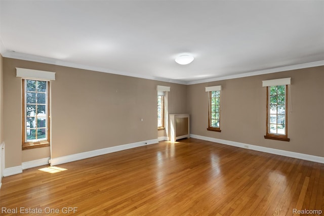 542 Cadieux Rd, Grosse Pointe, MI 48230 - empty room featuring light wood-style flooring and ornamental molding