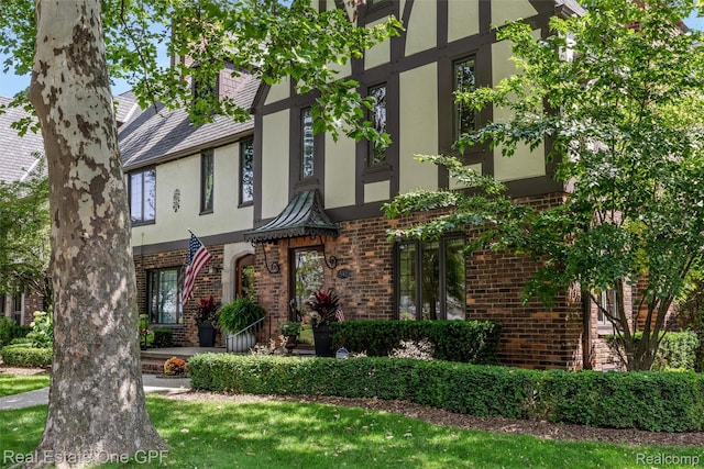 542 Cadieux Rd, Grosse Pointe, MI 48230 - tudor home with stucco siding and brick siding