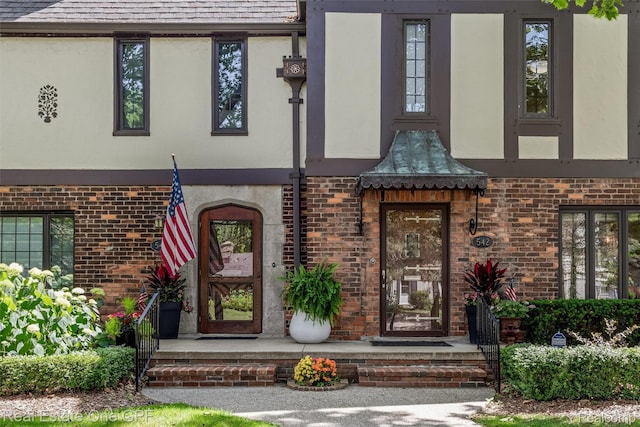 542 Cadieux Rd, Grosse Pointe, MI 48230 - property entrance featuring brick siding and stucco siding