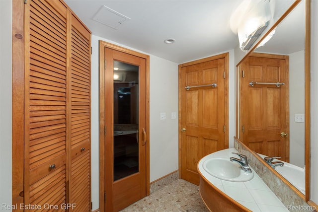 542 Cadieux Rd, Grosse Pointe, MI 48230 - bathroom featuring a closet, vanity, and a wall unit AC