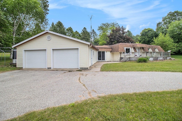 5890 N Oceana Dr, Hart, MI 49420 - view of front of home featuring a garage, a front yard, and a shingled roof