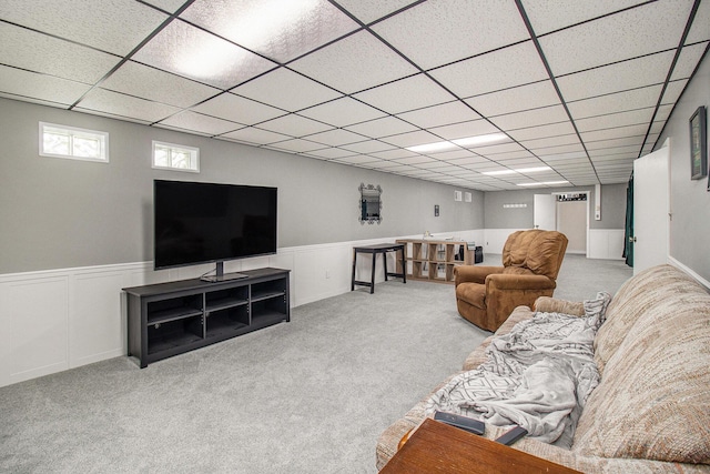 5890 N Oceana Dr, Hart, MI 49420 - carpeted living room featuring a paneled ceiling and a wainscoted wall