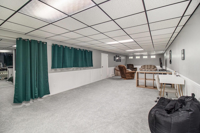 5890 N Oceana Dr, Hart, MI 49420 - living area featuring carpet, a paneled ceiling, and wainscoting