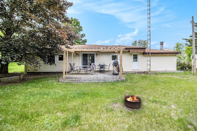 5890 N Oceana Dr, Hart, MI 49420 - back of house with an outdoor fire pit, a yard, a deck, and a pergola