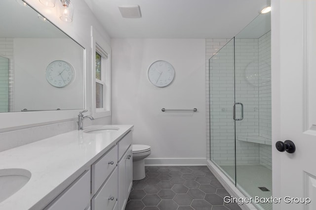 11569 Sessions Woods Dr W, Grand Rapids, MI 49534 - bathroom featuring double vanity, tile patterned floors, and a shower stall