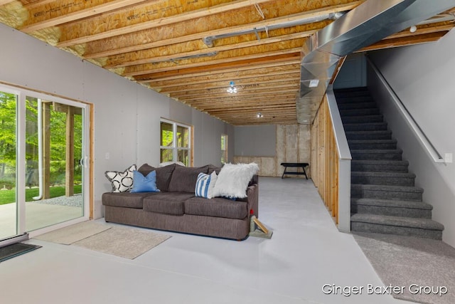 11569 Sessions Woods Dr W, Grand Rapids, MI 49534 - living area featuring finished concrete flooring and stairs